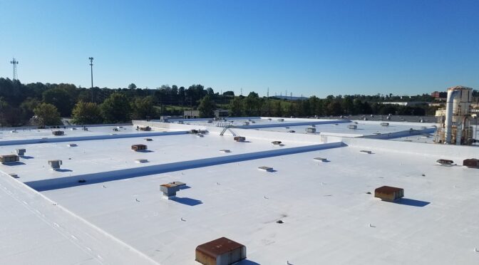 A commercial roof with Tremco AlphaGuard Coating