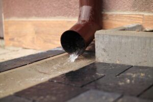 Water flowing out of a downspout.