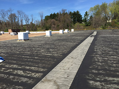 Built-up roof restoration in process