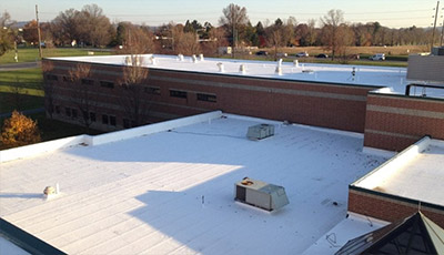 Commercial roof with elastomeric coating installed by Heidler Roofing