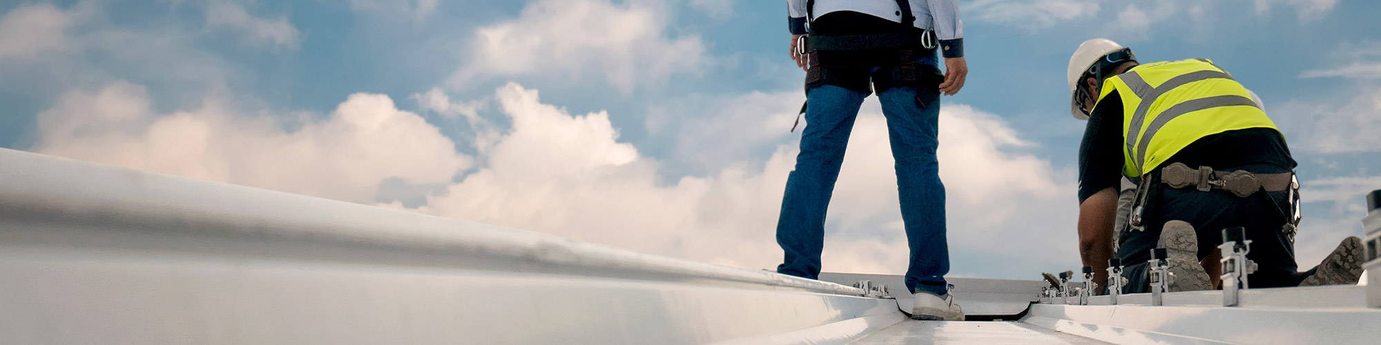 men inspecting a commercial roof