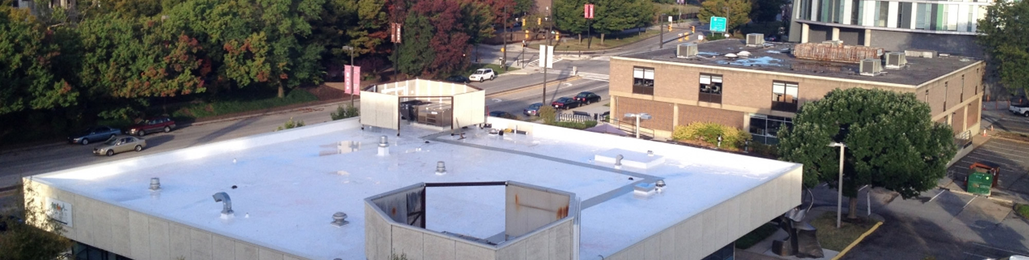 A commercial building with a TPO roof.