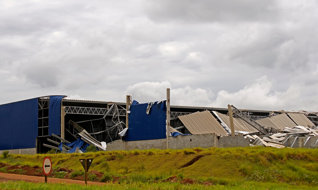 A collapsed commercial building after a storm.