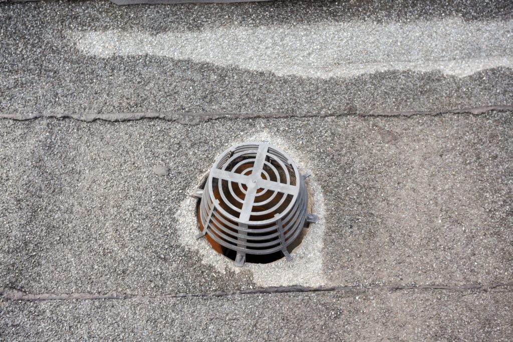 A drain on a commercial roof.