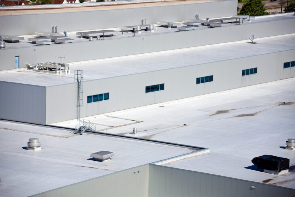 The white roof of a manufacturing facility