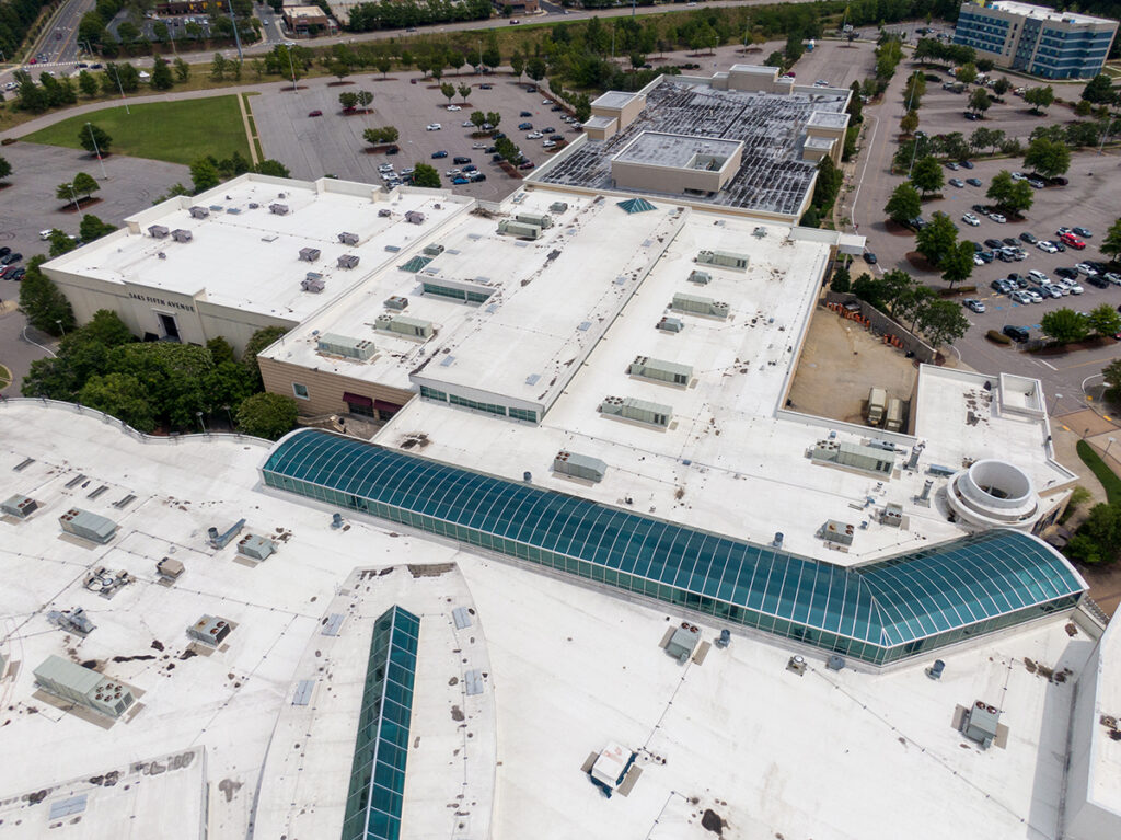 An image from a drone inspection of a large commercial building with large skylit hallways.